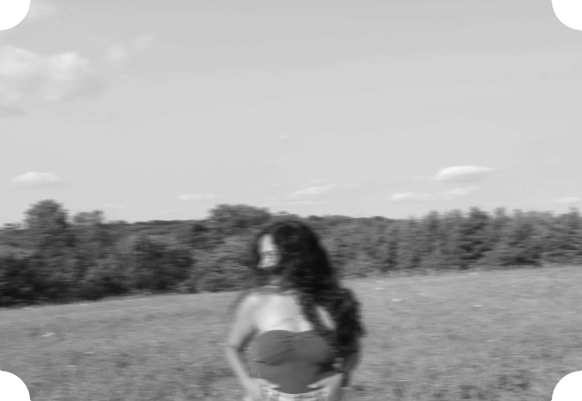 Richa, in black and white, in a field